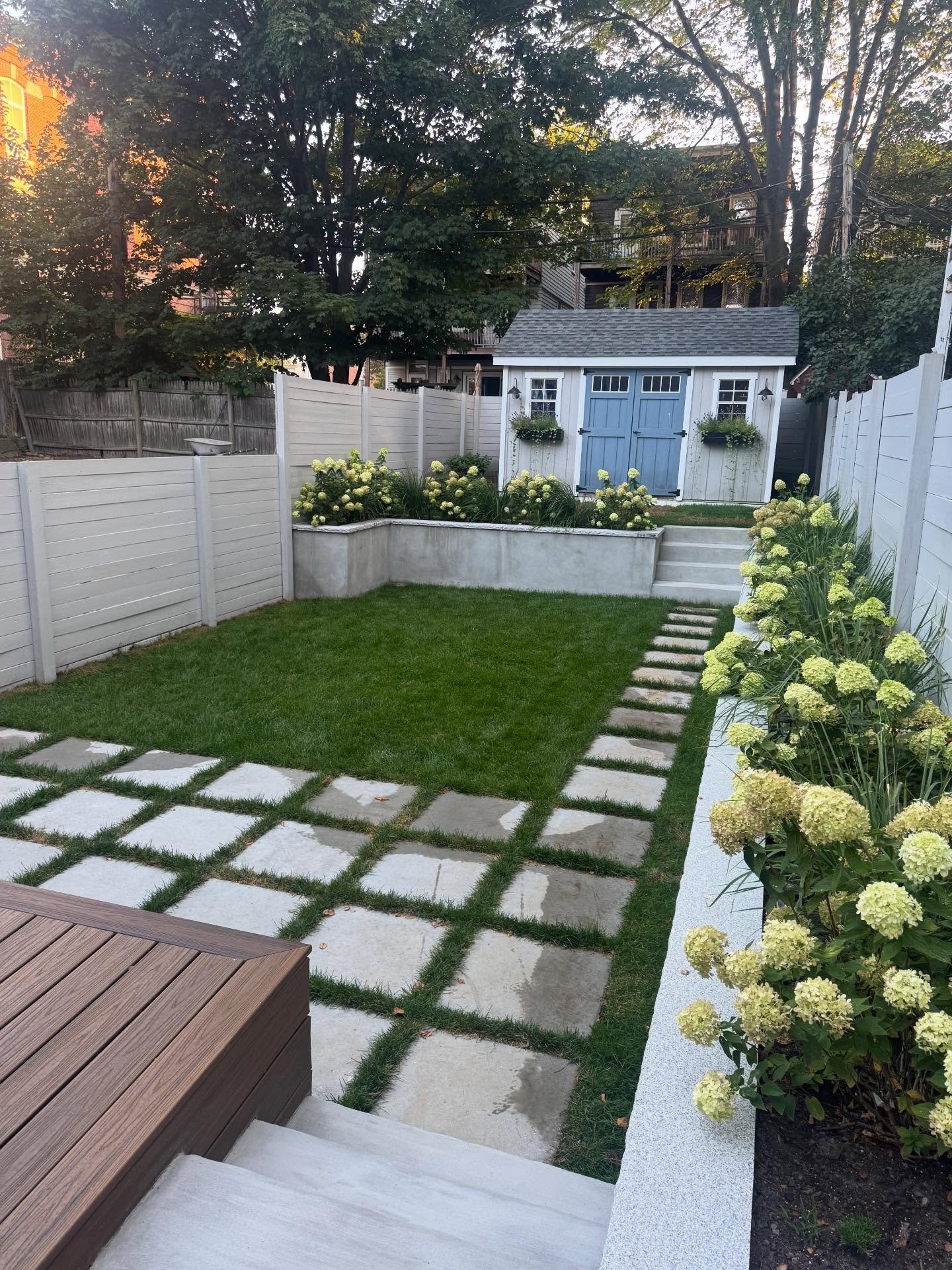 After: Backyard: pavers, lawn, fence and deck, South Boston